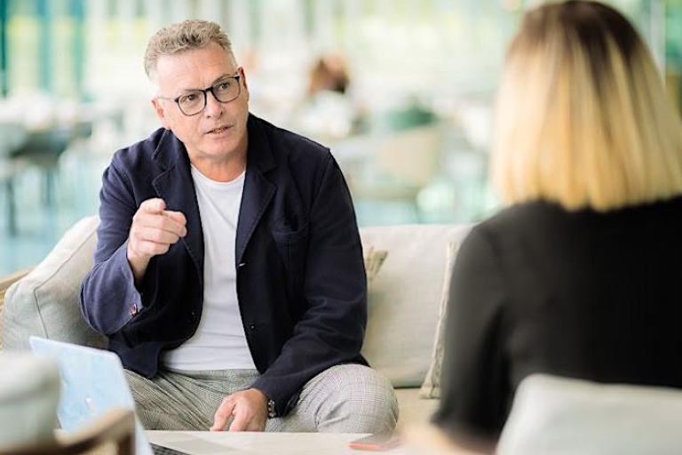 Man and woman talking in meeting